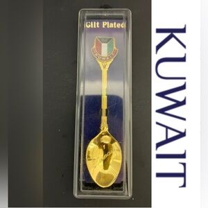 Collectible antique spoon with a Kuwaiti flag and engraved Kuwait.